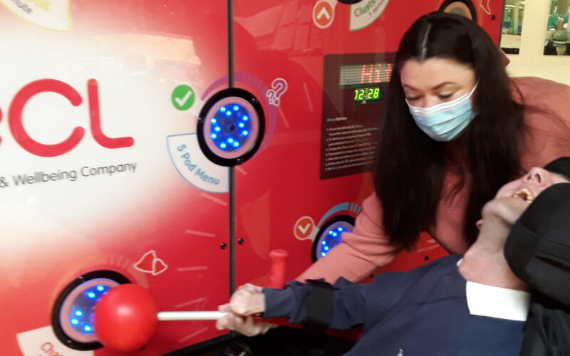 A man in a wheelchair enjoying playing a game