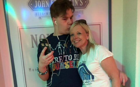 A man and a woman smiling