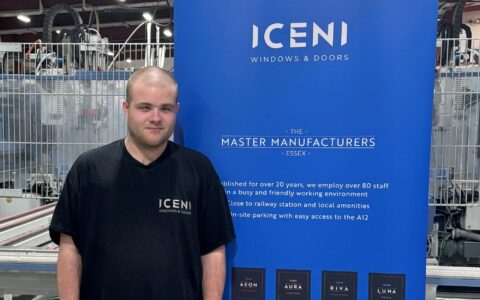 A photo of Callum next to an Iceni Windows banner.