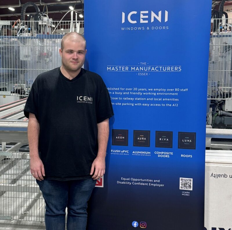 A photo of Callum next to an Iceni Windows banner.