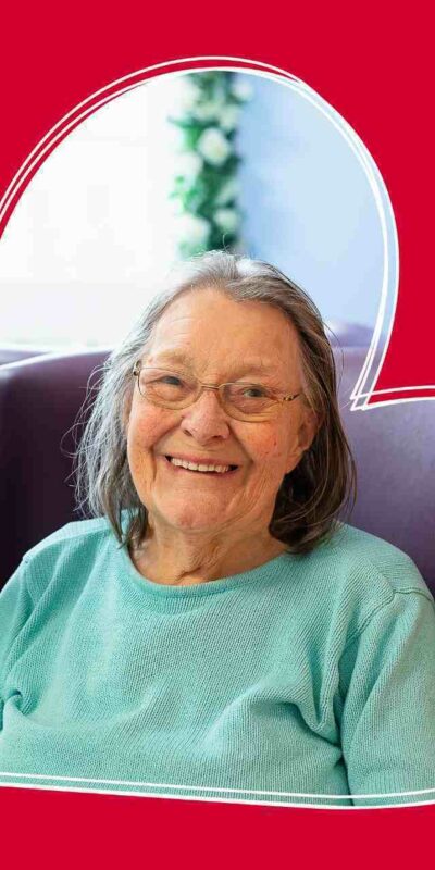 An old lady smiling.