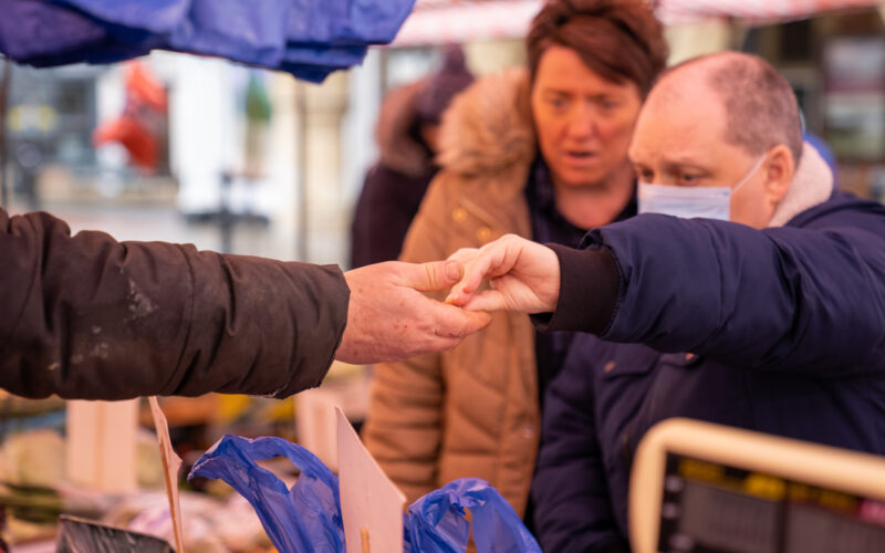 Two hands exchanging money