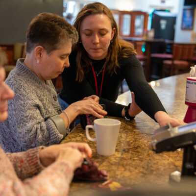 Carer helping out women