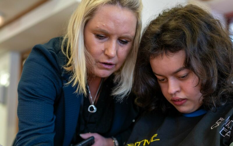 Carer helping person