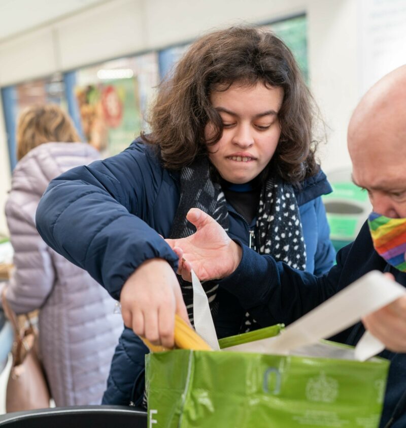 Young lady with learning disabilities shopping