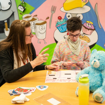 Carer helping patient