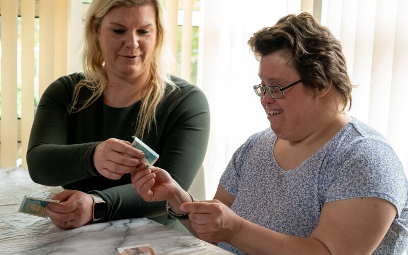 Carer helping patient