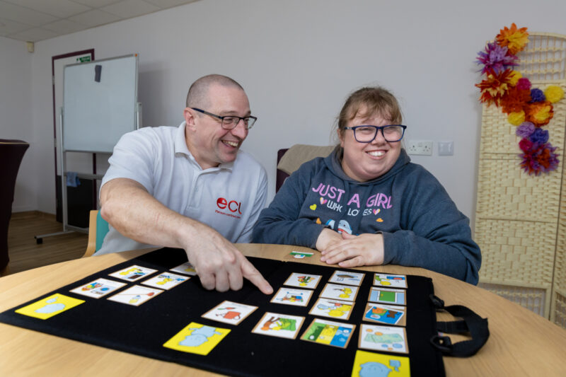 A positive behaviour support advisor doing a Talking Mat with a person with learning disabilities and autism