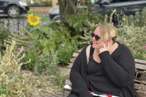 A woman sat on a bench.