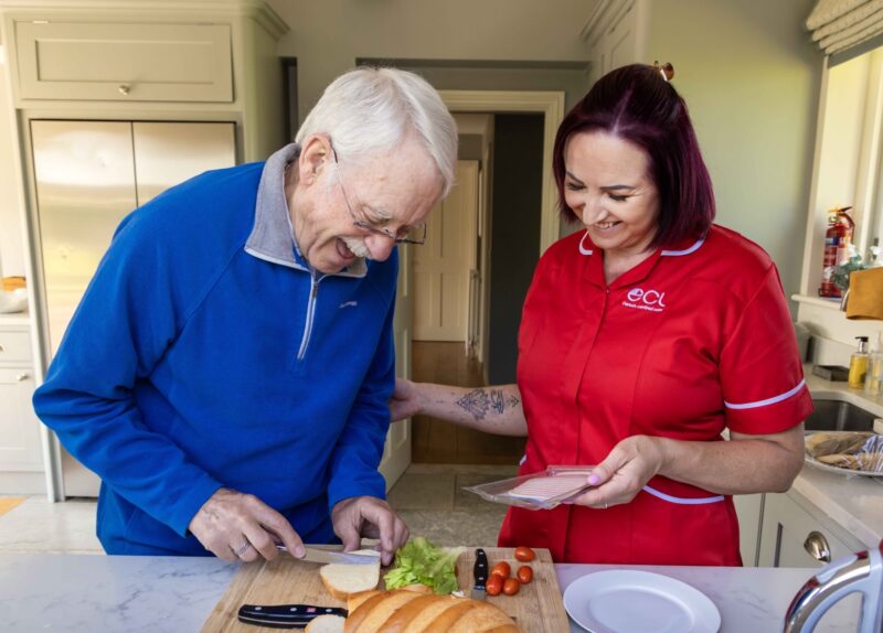 ECL employee and customer making a sandwich