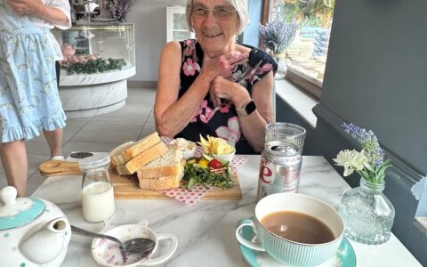 ECL customer Gill enjoying afternoon tea.