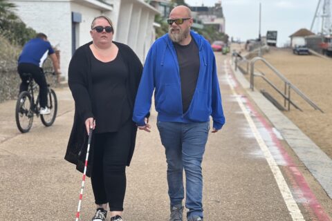 Woman walking with a cane
