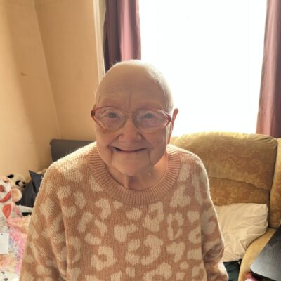 Picture of ECL customer Joan smiling at the camera