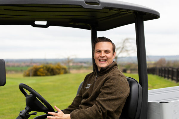 A man sitting in a vehicle.