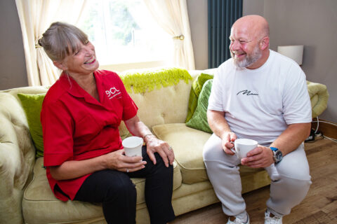 Two people talking and laughing